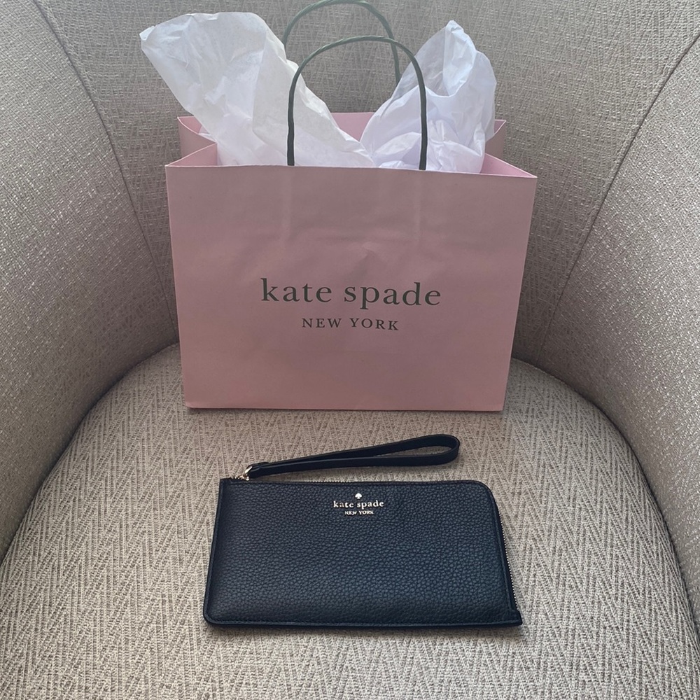 Kate Spade black leather wristlet. Lucy pebbled leather medi.